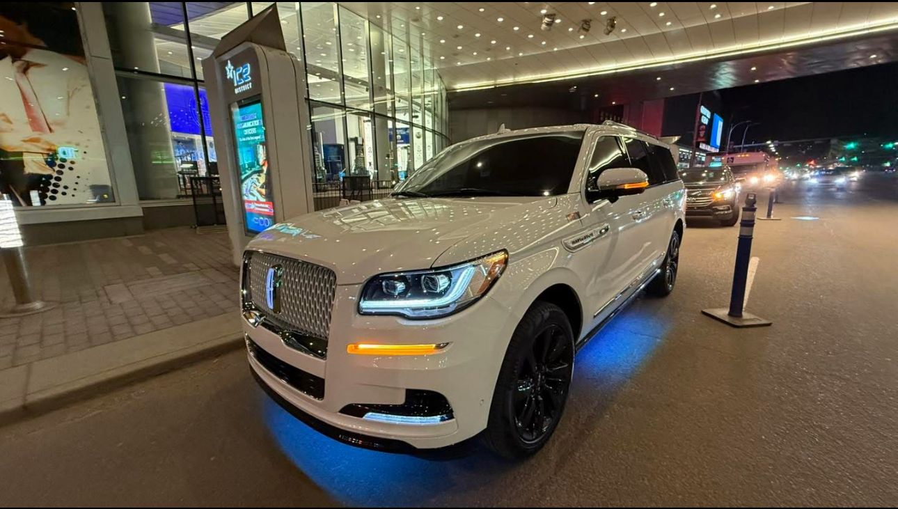 SUVs with private jet at airport