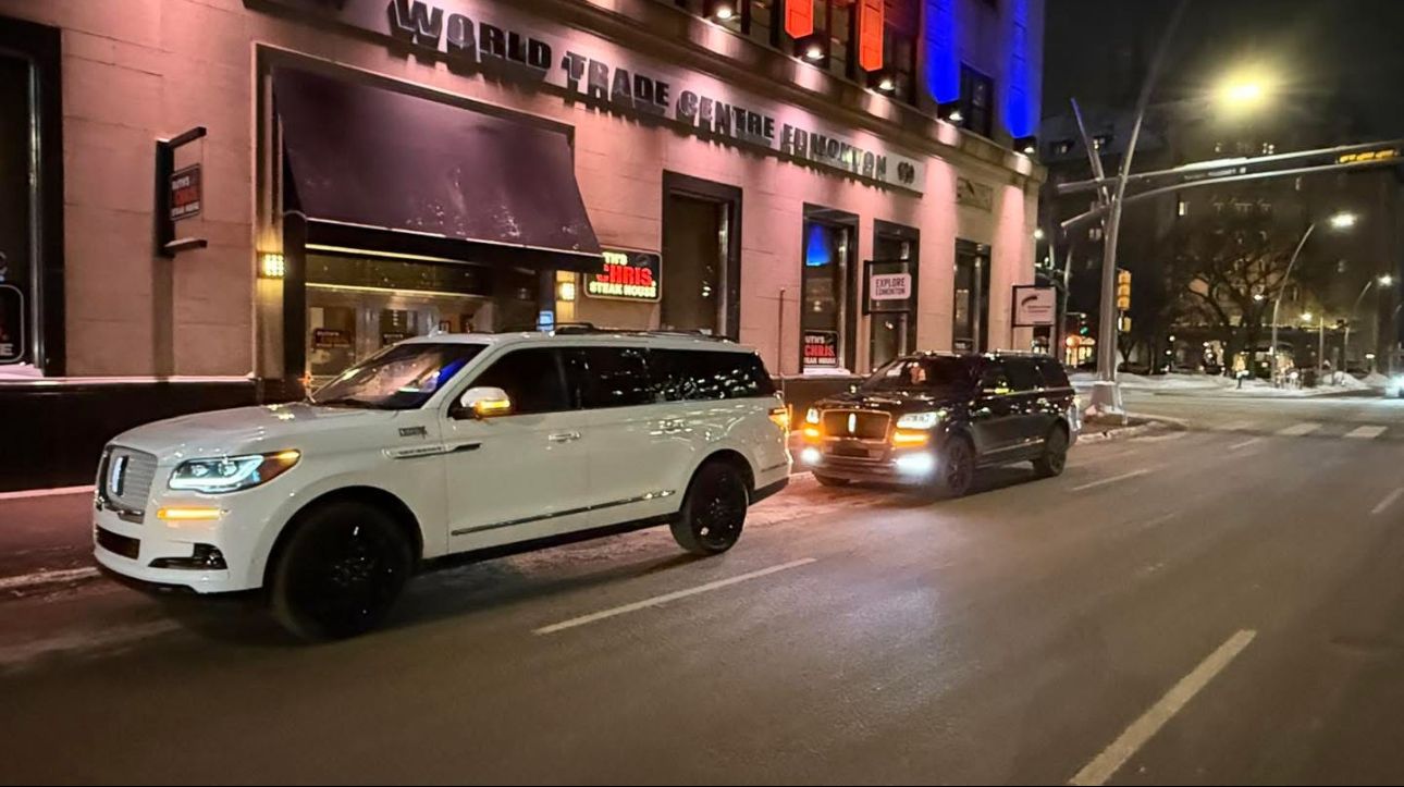 Black and white SUVs side by side